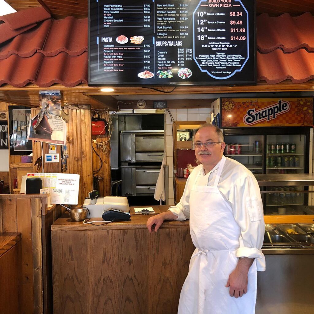 Tony inside the Buzz Buzz Pizza restaurant